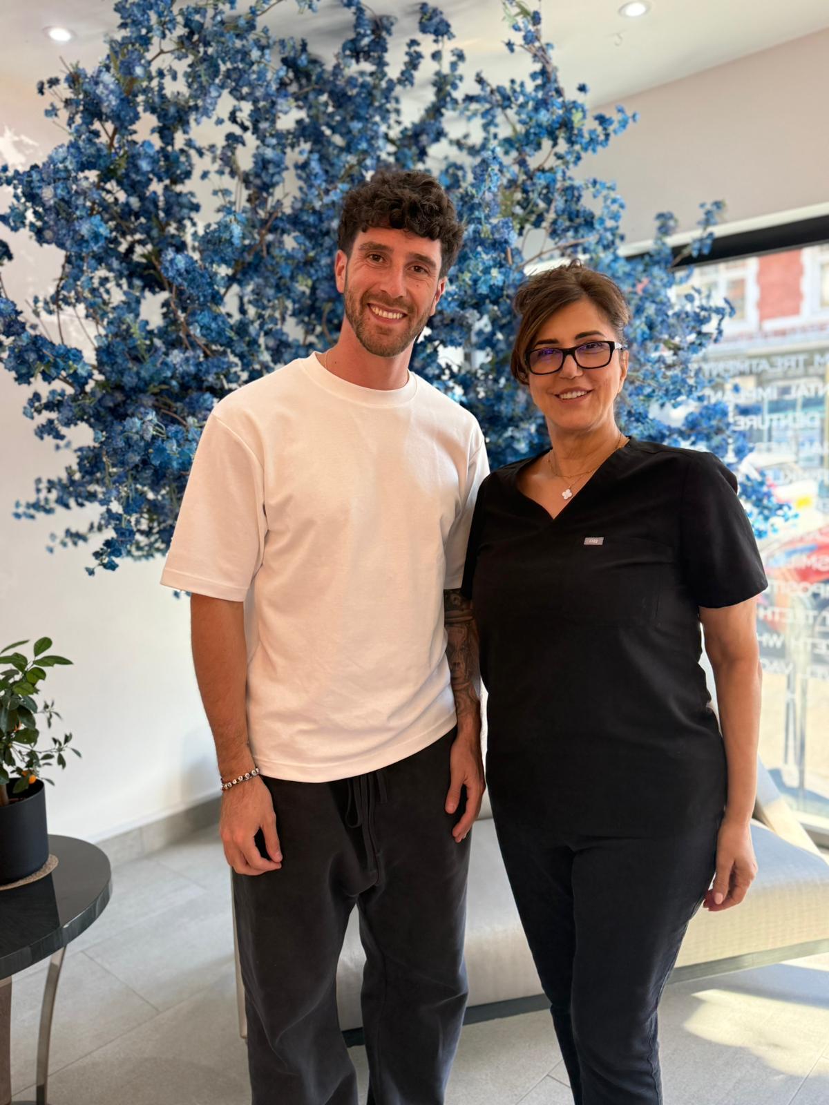 Happy patient with the team at Dental On The Banks